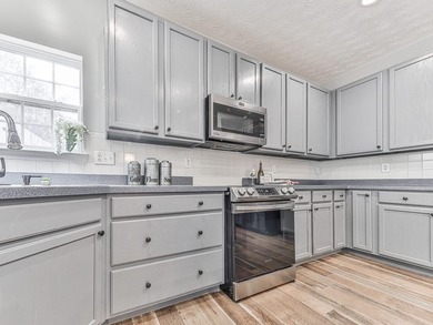 Lake & Golf Cart Living! This beautiful, spacious home offers 5 on Mirror Lake Golf Club in Georgia - for sale on GolfHomes.com, golf home, golf lot