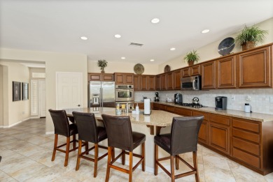 Perched on an elevated 7,841 sq. ft. lot overlooking the 9th on Golf Club At La Quinta in California - for sale on GolfHomes.com, golf home, golf lot