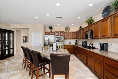 Perched on an elevated 7,841 sq. ft. lot overlooking the 9th on Golf Club At La Quinta in California - for sale on GolfHomes.com, golf home, golf lot