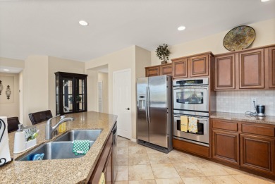 Perched on an elevated 7,841 sq. ft. lot overlooking the 9th on Golf Club At La Quinta in California - for sale on GolfHomes.com, golf home, golf lot