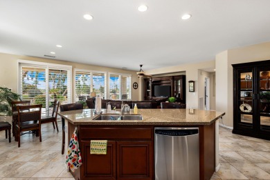 Perched on an elevated 7,841 sq. ft. lot overlooking the 9th on Golf Club At La Quinta in California - for sale on GolfHomes.com, golf home, golf lot