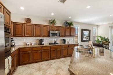 Perched on an elevated 7,841 sq. ft. lot overlooking the 9th on Golf Club At La Quinta in California - for sale on GolfHomes.com, golf home, golf lot