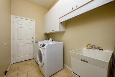 Located in the prestigious, manned and guard-gated community of on Hunters Green Country Club in Florida - for sale on GolfHomes.com, golf home, golf lot