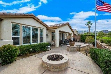 Perched on an elevated 7,841 sq. ft. lot overlooking the 9th on Golf Club At La Quinta in California - for sale on GolfHomes.com, golf home, golf lot