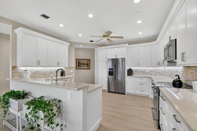 Gorgeous, sweeping  views of golf course and lake from on Atlantis Golf Club in Florida - for sale on GolfHomes.com, golf home, golf lot