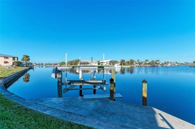 Fall in love with this 2015 built custom waterfront pool home on Saint Andrews South Golf Club in Florida - for sale on GolfHomes.com, golf home, golf lot