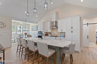 This open and airy home with golf and pond views is ready for a on Sea Trail Golf Resort in North Carolina - for sale on GolfHomes.com, golf home, golf lot