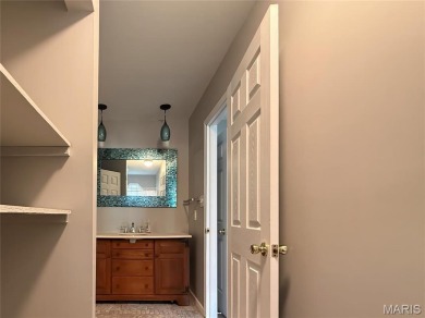 Nestled along the shoreline in a serene lake community, this on Terre Du Lac Golf and Country Club in Missouri - for sale on GolfHomes.com, golf home, golf lot