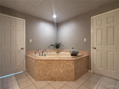 Nestled along the shoreline in a serene lake community, this on Terre Du Lac Golf and Country Club in Missouri - for sale on GolfHomes.com, golf home, golf lot