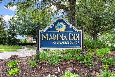 Indulge in sophisticated coastal living at this exquisite condo on Grande Dunes Golf Club in South Carolina - for sale on GolfHomes.com, golf home, golf lot