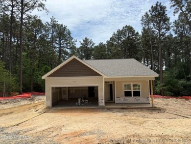 Now available and nearing completion, the 'Emeline' single level on Foxfire Golf and Country Club in North Carolina - for sale on GolfHomes.com, golf home, golf lot