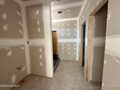 Now available and nearing completion, the 'Emeline' single level on Foxfire Golf and Country Club in North Carolina - for sale on GolfHomes.com, golf home, golf lot