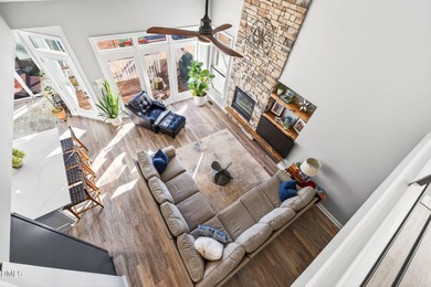 Wake up to breathtaking panoramic lake views from this on River Golf and Country Club at Lake Royale in North Carolina - for sale on GolfHomes.com, golf home, golf lot