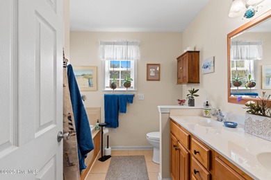 Welcome to this charming coastal 3 bedroom, 2 bath residence in on Lockwood Folly Country Club in North Carolina - for sale on GolfHomes.com, golf home, golf lot