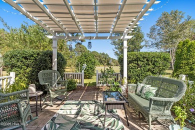 Welcome to this charming coastal 3 bedroom, 2 bath residence in on Lockwood Folly Country Club in North Carolina - for sale on GolfHomes.com, golf home, golf lot