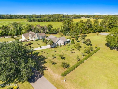 Welcome to this charming coastal 3 bedroom, 2 bath residence in on Lockwood Folly Country Club in North Carolina - for sale on GolfHomes.com, golf home, golf lot