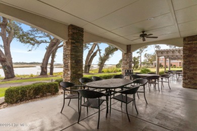 Welcome to this charming coastal 3 bedroom, 2 bath residence in on Lockwood Folly Country Club in North Carolina - for sale on GolfHomes.com, golf home, golf lot
