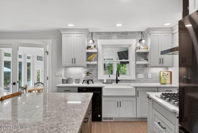 Prepare to be captivated by this extraordinary coastal sanctuary on The Lakes Country Club in North Carolina - for sale on GolfHomes.com, golf home, golf lot