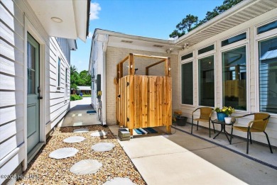 Prepare to be captivated by this extraordinary coastal sanctuary on The Lakes Country Club in North Carolina - for sale on GolfHomes.com, golf home, golf lot