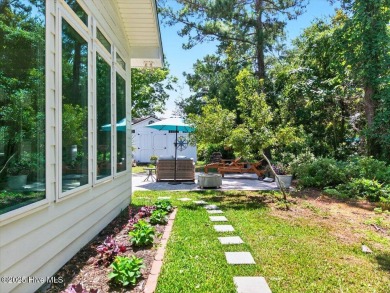 Prepare to be captivated by this extraordinary coastal sanctuary on The Lakes Country Club in North Carolina - for sale on GolfHomes.com, golf home, golf lot