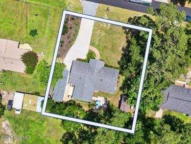 Prepare to be captivated by this extraordinary coastal sanctuary on The Lakes Country Club in North Carolina - for sale on GolfHomes.com, golf home, golf lot