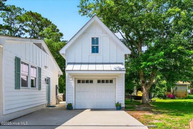 Prepare to be captivated by this extraordinary coastal sanctuary on The Lakes Country Club in North Carolina - for sale on GolfHomes.com, golf home, golf lot