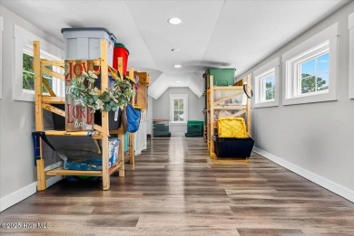 Prepare to be captivated by this extraordinary coastal sanctuary on The Lakes Country Club in North Carolina - for sale on GolfHomes.com, golf home, golf lot