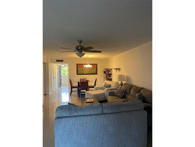Enjoy comfort, space, and peace of mind in this spacious on Inverrary Country Club in Florida - for sale on GolfHomes.com, golf home, golf lot