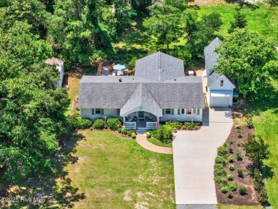 Prepare to be captivated by this extraordinary coastal sanctuary on The Lakes Country Club in North Carolina - for sale on GolfHomes.com, golf home, golf lot
