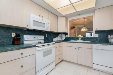 Enjoy spectacular golf views from this centrally located condo on Capri Isle Golf Club in Florida - for sale on GolfHomes.com, golf home, golf lot