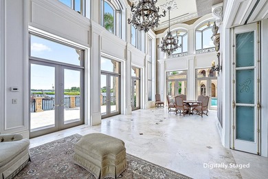 Introducing a palatial waterfront estate on a double lot in the on Jonathans Landing Golf Club in Florida - for sale on GolfHomes.com, golf home, golf lot