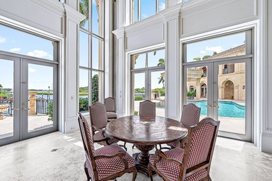 Introducing a palatial waterfront estate on a double lot in the on Jonathans Landing Golf Club in Florida - for sale on GolfHomes.com, golf home, golf lot