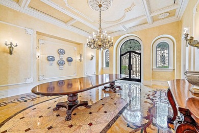 Introducing a palatial waterfront estate on a double lot in the on Jonathans Landing Golf Club in Florida - for sale on GolfHomes.com, golf home, golf lot