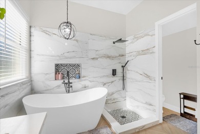 Experience golf course living at its finest in this beautifully on Hunters Creek Golf Course in Florida - for sale on GolfHomes.com, golf home, golf lot