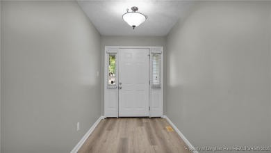 Welcome to this beautifully maintained 3-bedroom, 2-bathroom on Carolina Lakes Country Club in North Carolina - for sale on GolfHomes.com, golf home, golf lot