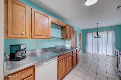 Nestled in one of Hampstead's most desirable neighborhoods, this on Belvedere Country Club in North Carolina - for sale on GolfHomes.com, golf home, golf lot