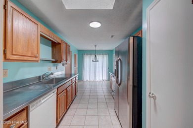 Nestled in one of Hampstead's most desirable neighborhoods, this on Belvedere Country Club in North Carolina - for sale on GolfHomes.com, golf home, golf lot