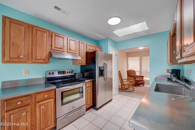 Nestled in one of Hampstead's most desirable neighborhoods, this on Belvedere Country Club in North Carolina - for sale on GolfHomes.com, golf home, golf lot