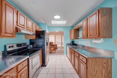 Nestled in one of Hampstead's most desirable neighborhoods, this on Belvedere Country Club in North Carolina - for sale on GolfHomes.com, golf home, golf lot