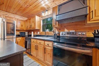 Nestled atop a gentle hill and surrounded by graceful Hemlocks on White Path Golf Club in Georgia - for sale on GolfHomes.com, golf home, golf lot
