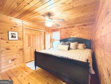 Nestled atop a gentle hill and surrounded by graceful Hemlocks on White Path Golf Club in Georgia - for sale on GolfHomes.com, golf home, golf lot