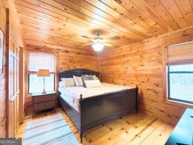 Nestled atop a gentle hill and surrounded by graceful Hemlocks on White Path Golf Club in Georgia - for sale on GolfHomes.com, golf home, golf lot