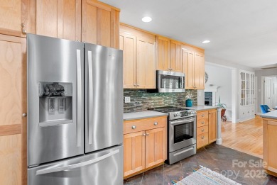 Discover this charming Black Mountain cottage, ideally situated on Black Mountain Golf Course in North Carolina - for sale on GolfHomes.com, golf home, golf lot
