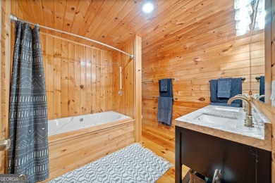 Nestled atop a gentle hill and surrounded by graceful Hemlocks on White Path Golf Club in Georgia - for sale on GolfHomes.com, golf home, golf lot