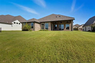 This stunning Pecan Plantation home offers peaceful views of a on Pecan Plantation Country Club in Texas - for sale on GolfHomes.com, golf home, golf lot