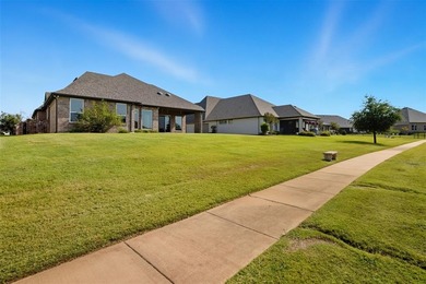 This stunning Pecan Plantation home offers peaceful views of a on Pecan Plantation Country Club in Texas - for sale on GolfHomes.com, golf home, golf lot