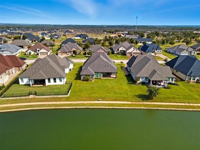 This stunning Pecan Plantation home offers peaceful views of a on Pecan Plantation Country Club in Texas - for sale on GolfHomes.com, golf home, golf lot