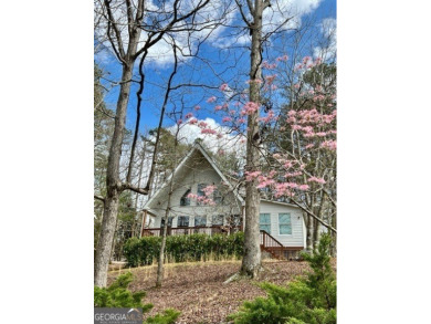 Nestled atop a gentle hill and surrounded by graceful Hemlocks on White Path Golf Club in Georgia - for sale on GolfHomes.com, golf home, golf lot