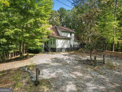 Nestled atop a gentle hill and surrounded by graceful Hemlocks on White Path Golf Club in Georgia - for sale on GolfHomes.com, golf home, golf lot