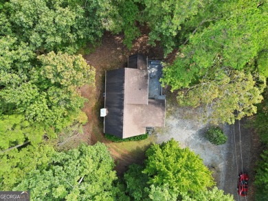 Nestled atop a gentle hill and surrounded by graceful Hemlocks on White Path Golf Club in Georgia - for sale on GolfHomes.com, golf home, golf lot